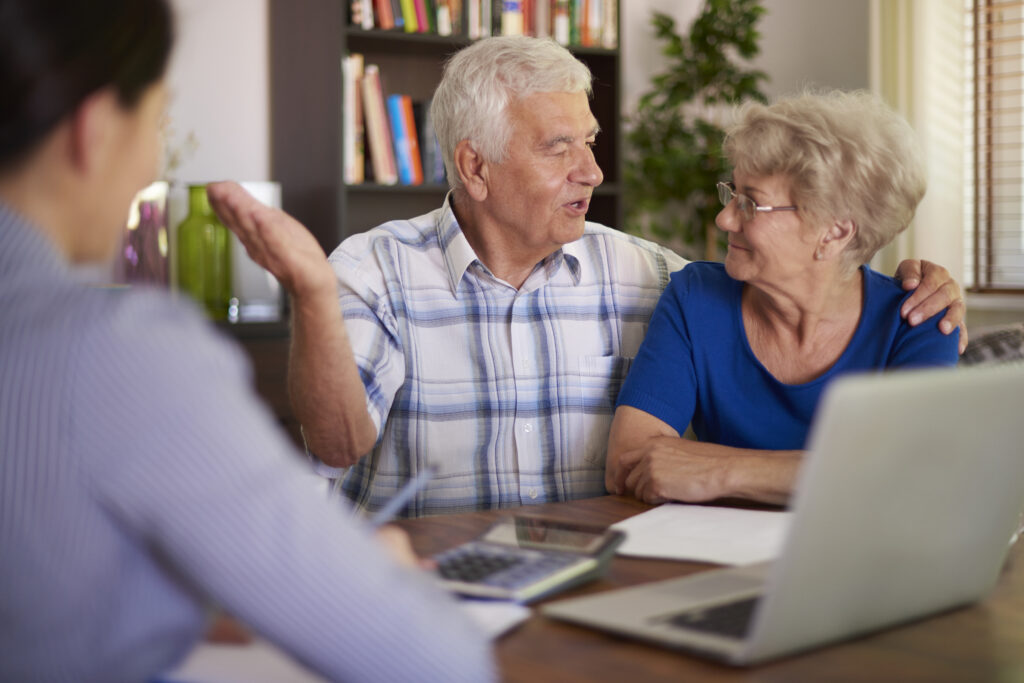 senior couple making a financial deal