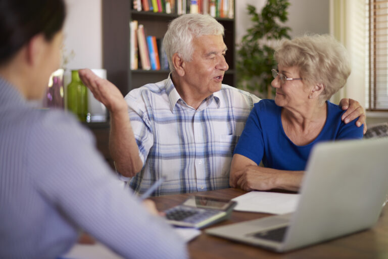 senior couple making a financial deal